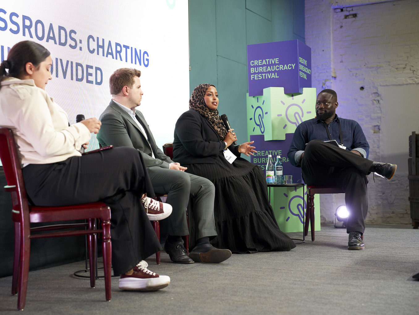 Panel "DEI at a Crossroads: Charting the Future in a Divided Landscape" on stage