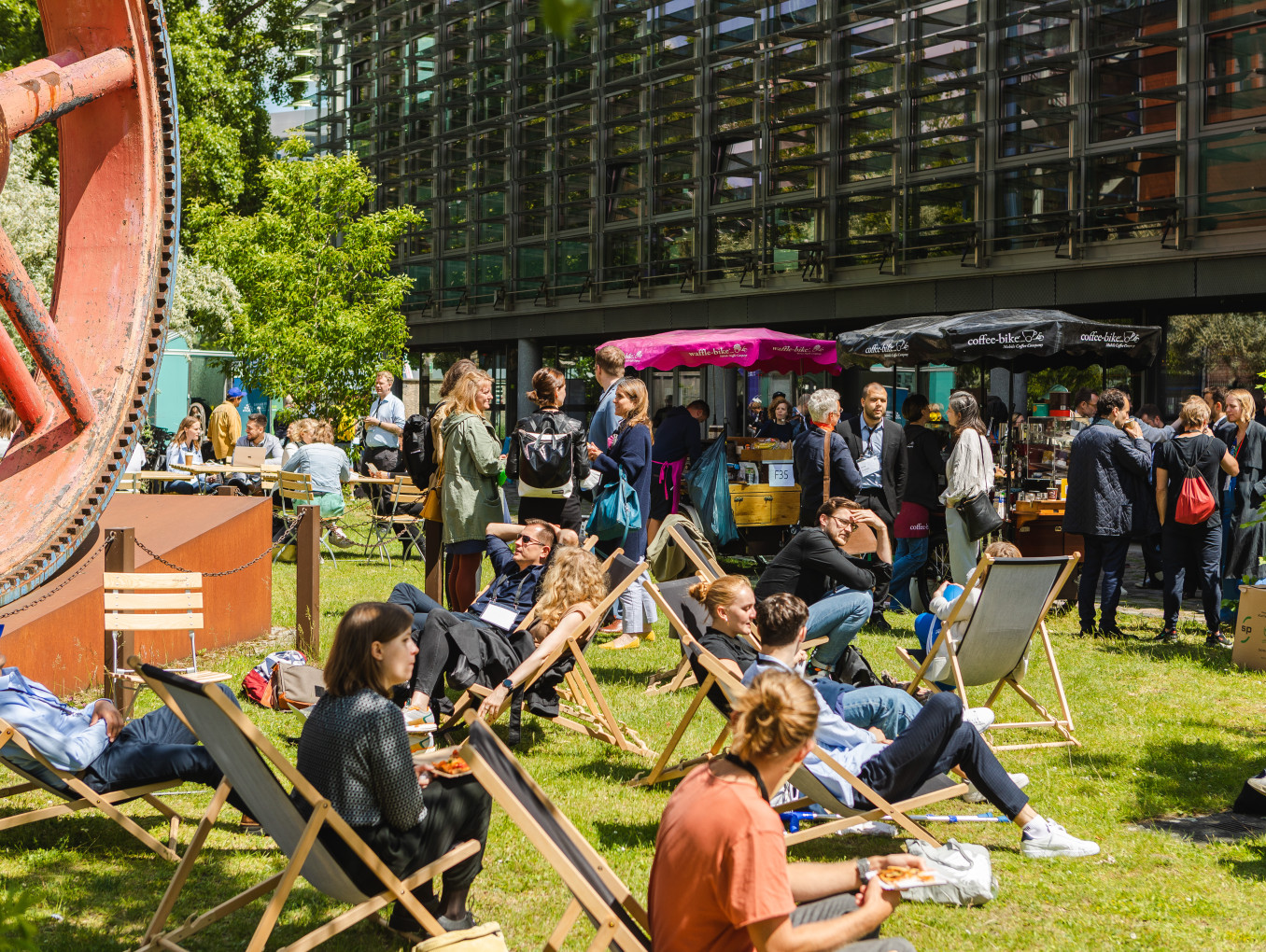 outside festival area, people sitting and talking 