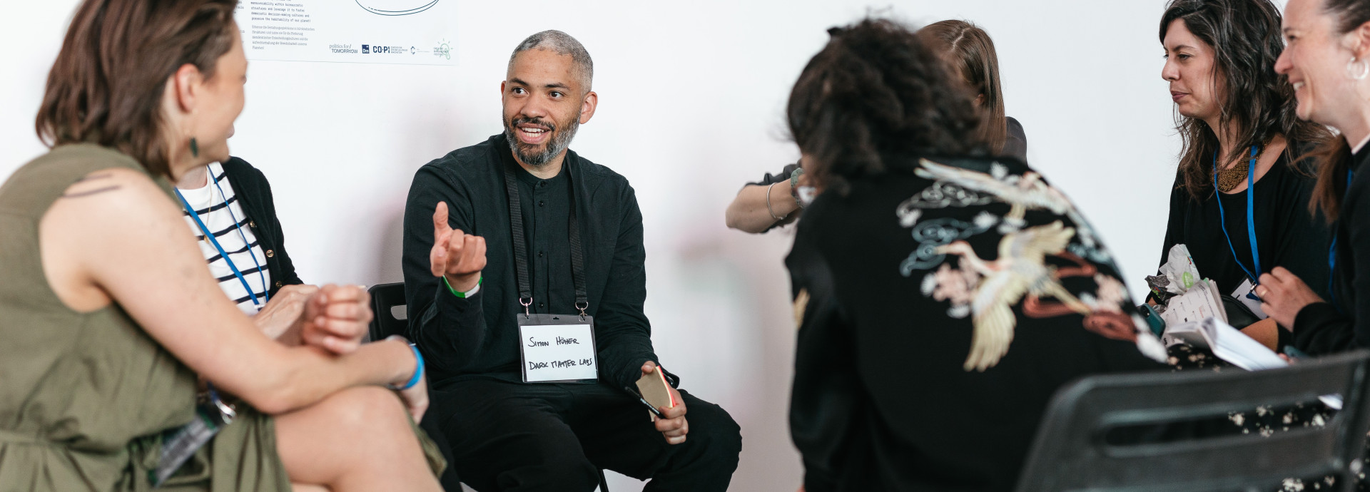 people sitting in a circle and chatting 