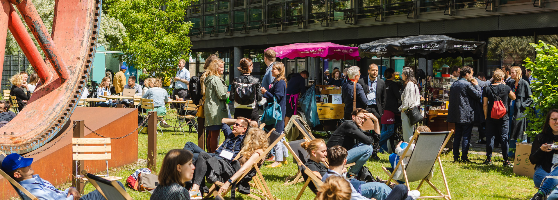 outside festival area, people sitting and talking 