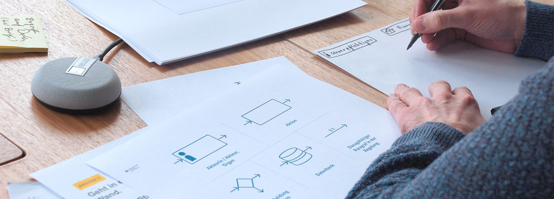 Person writing on a paper at a desk