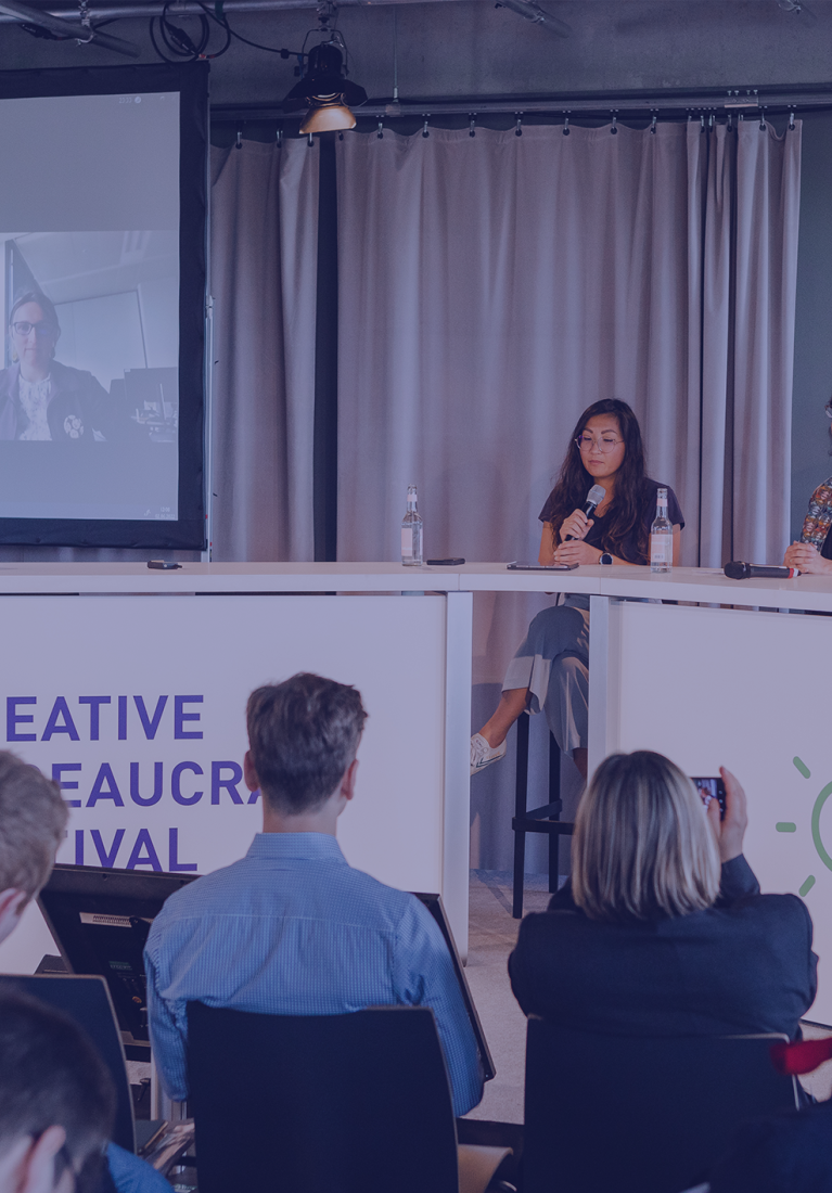 three women sitting on a stage counter