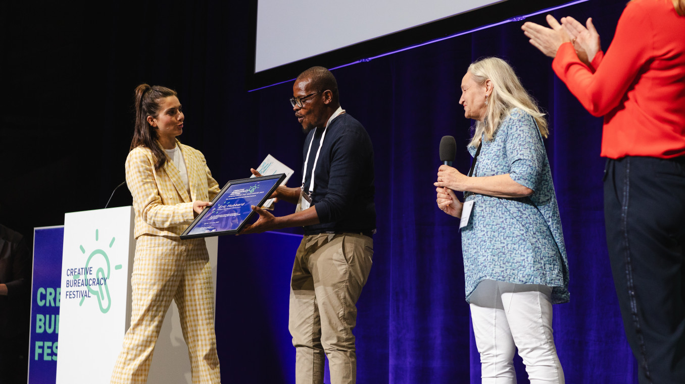 Eric Hubbard receiving the Festival Award on stage 