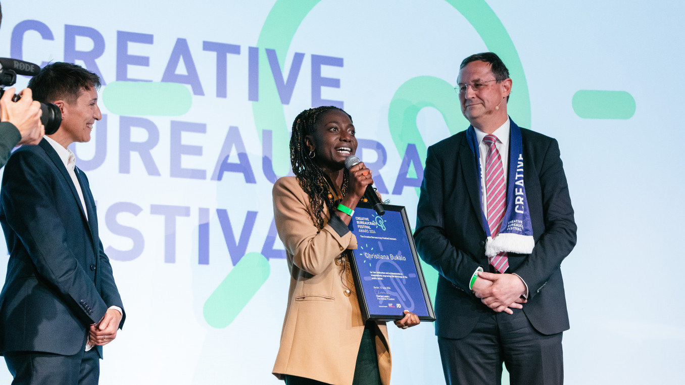 Christiana Bukalo receiving the award on stage 