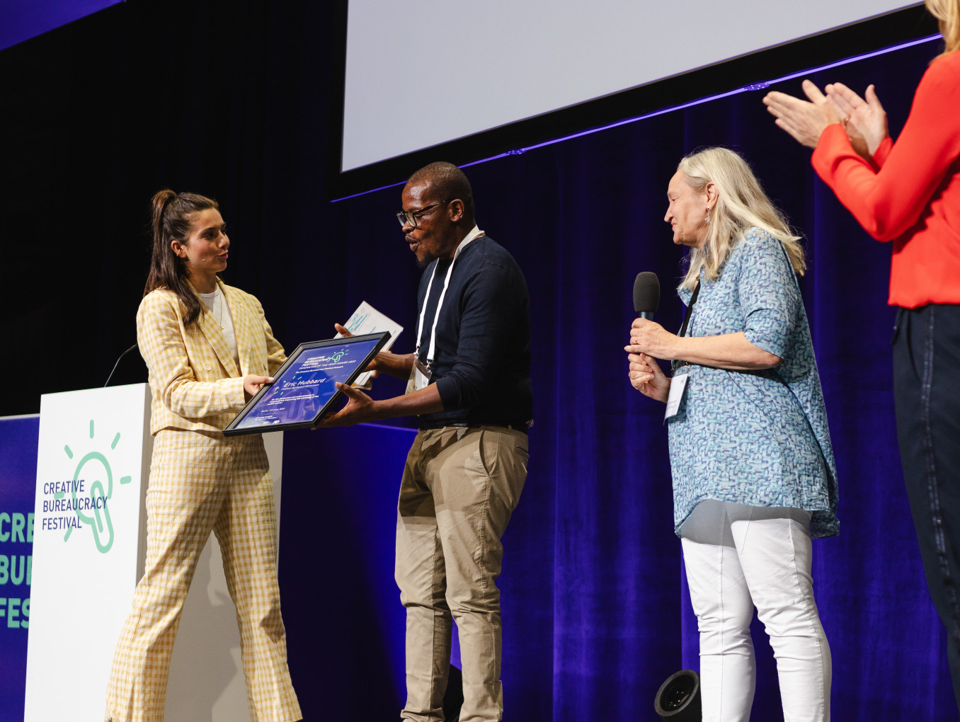 Eric Hubbard receiving the Festival Award on stage