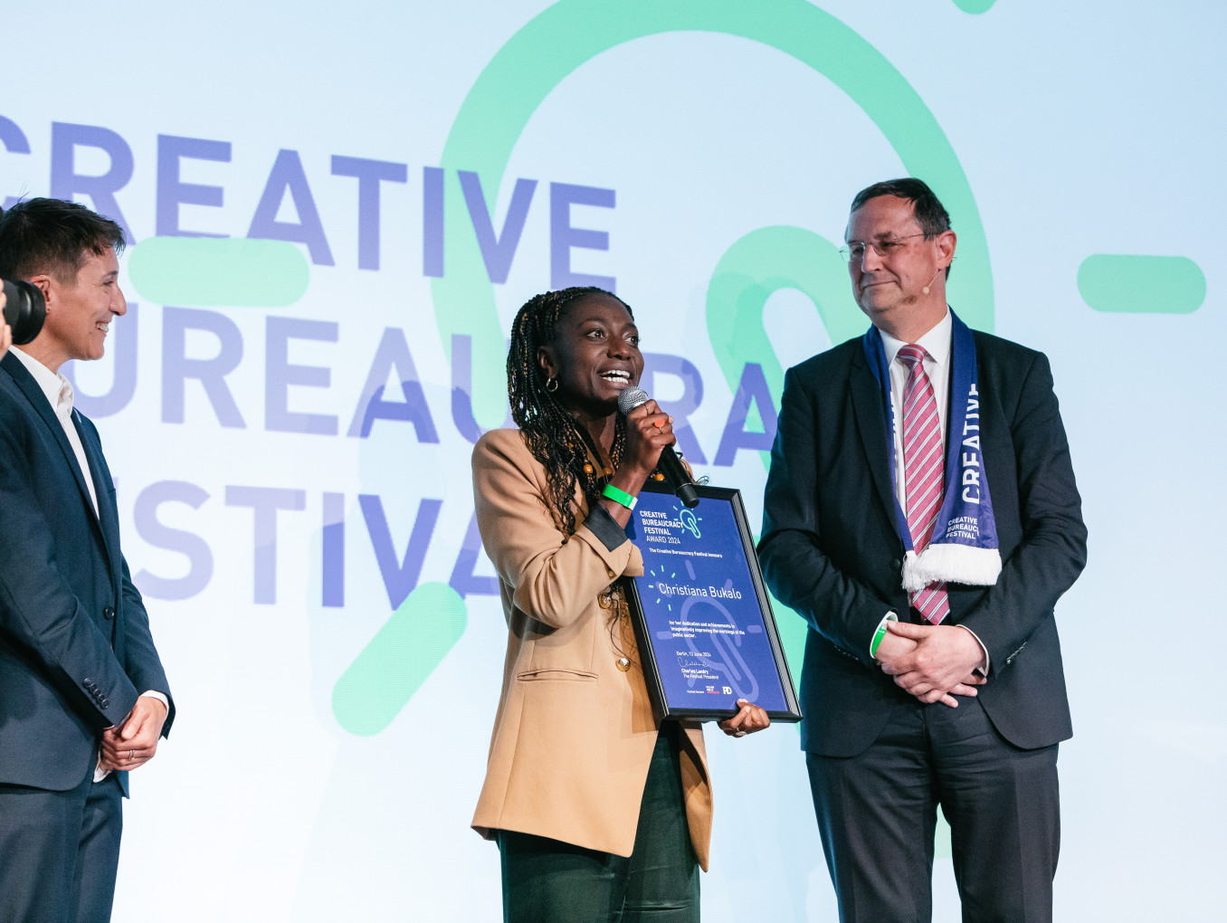 Christiana Bukalo receiving the award on stage