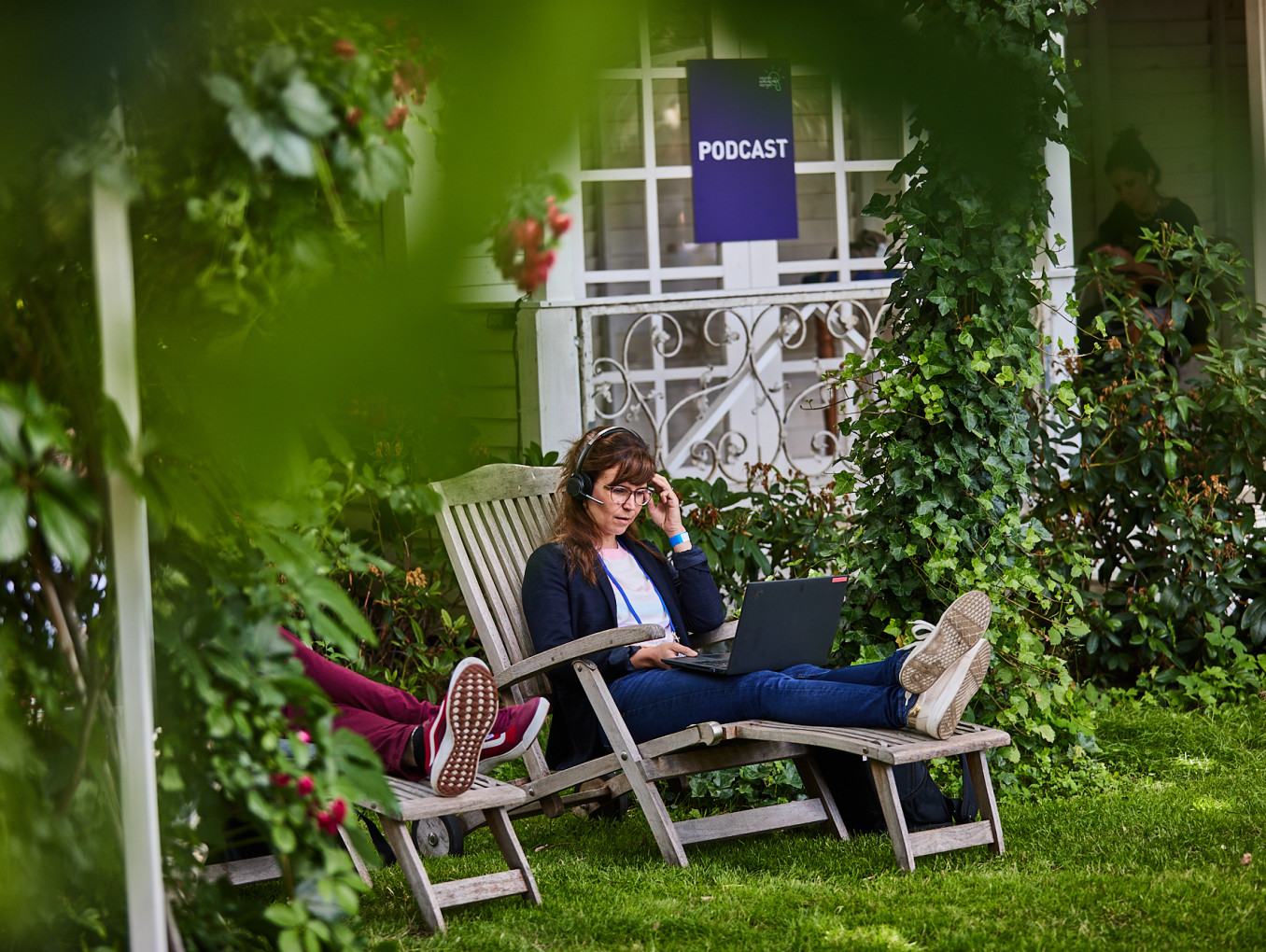 woman in a video call on her laptop outside