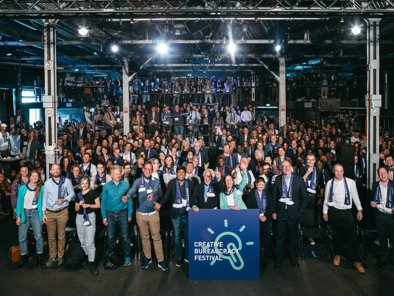 big crowd of Creative Bureaucrats celebrating and standing together for a photo