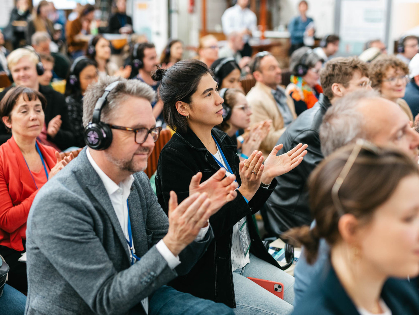 people at transfomration stage clapping