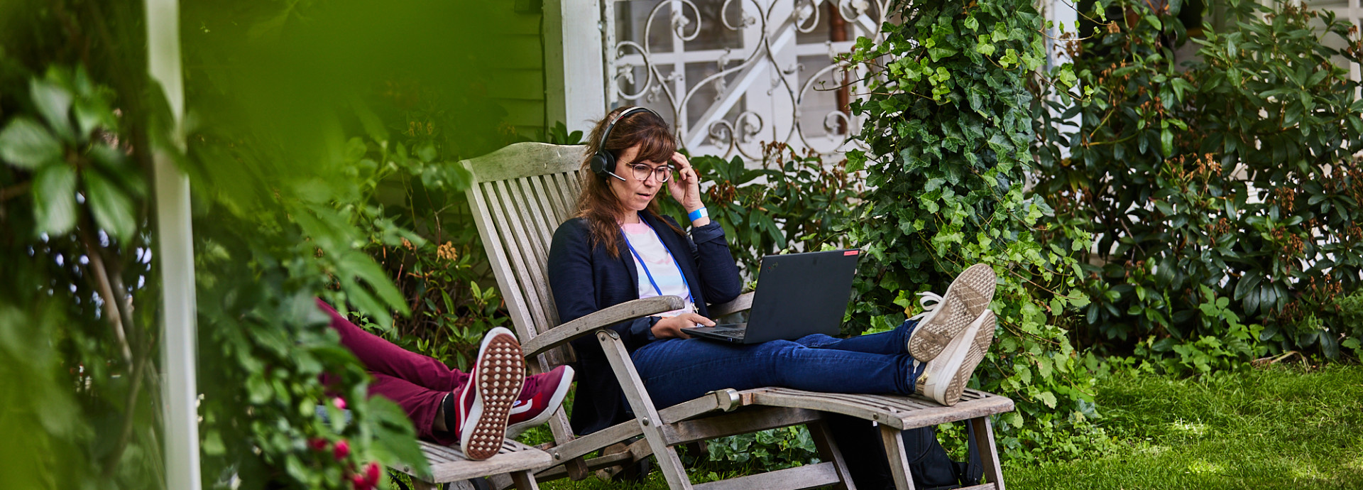woman in a video call on her laptop outside