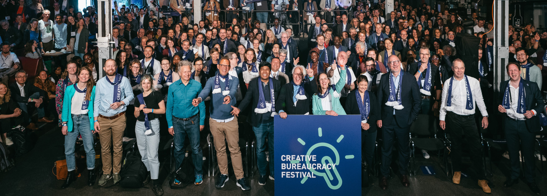 big crowd of Creative Bureaucrats celebrating and standing together for a photo